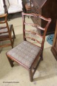 A set of six George III style mahogany pierced ladderback dining chairs