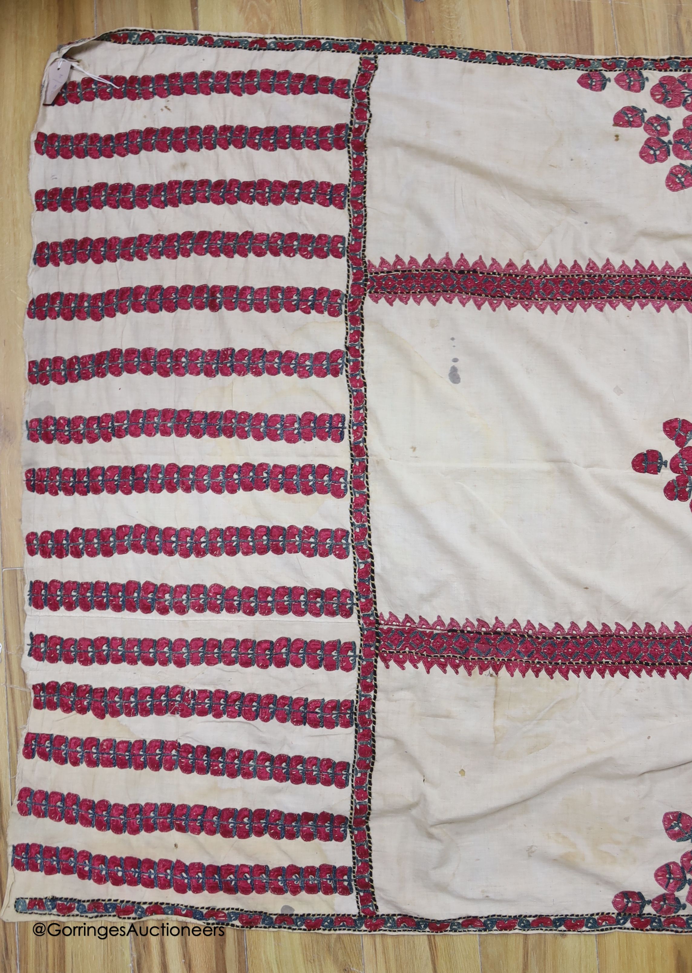 A silk embroidered Suzani, embroidered with cherry red flower heads with green stems and leaves in - Image 2 of 6