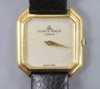 A lady's 18ct gold Baume & Mercier manual wing octagonal dial wrist watch, on associated leather
