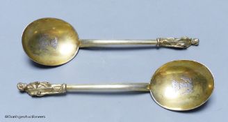 A pair of 19th century Hungarian? gilt white metal apostle spoons, 19.1cm, with engraved crests,