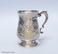 A George III silver baluster mug, with later embossed decoration, London, 1770, 12.7cm, 12.5 oz,