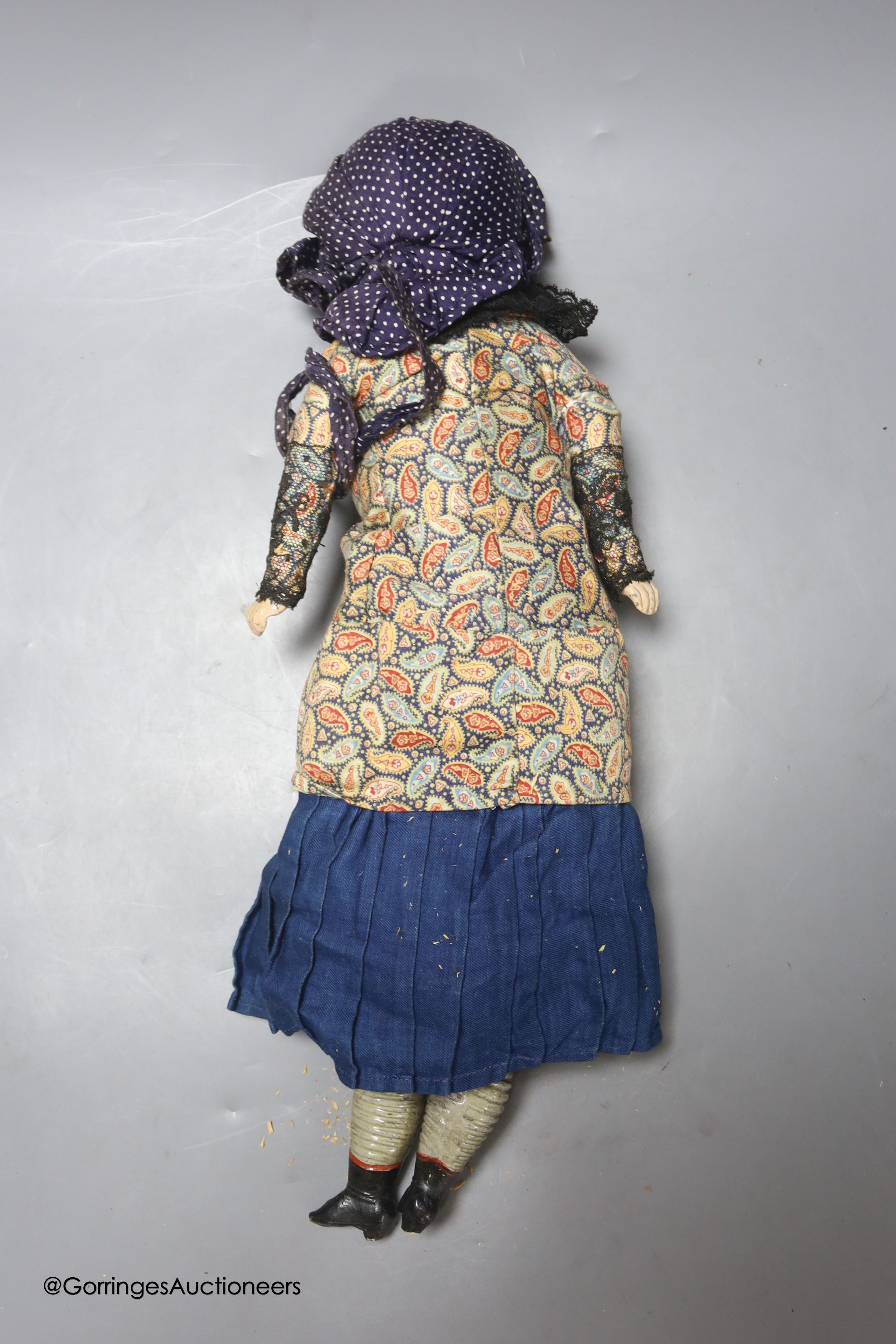 A wax composition doll, In early clothing, one leg detached but present, 18ins - Image 2 of 2