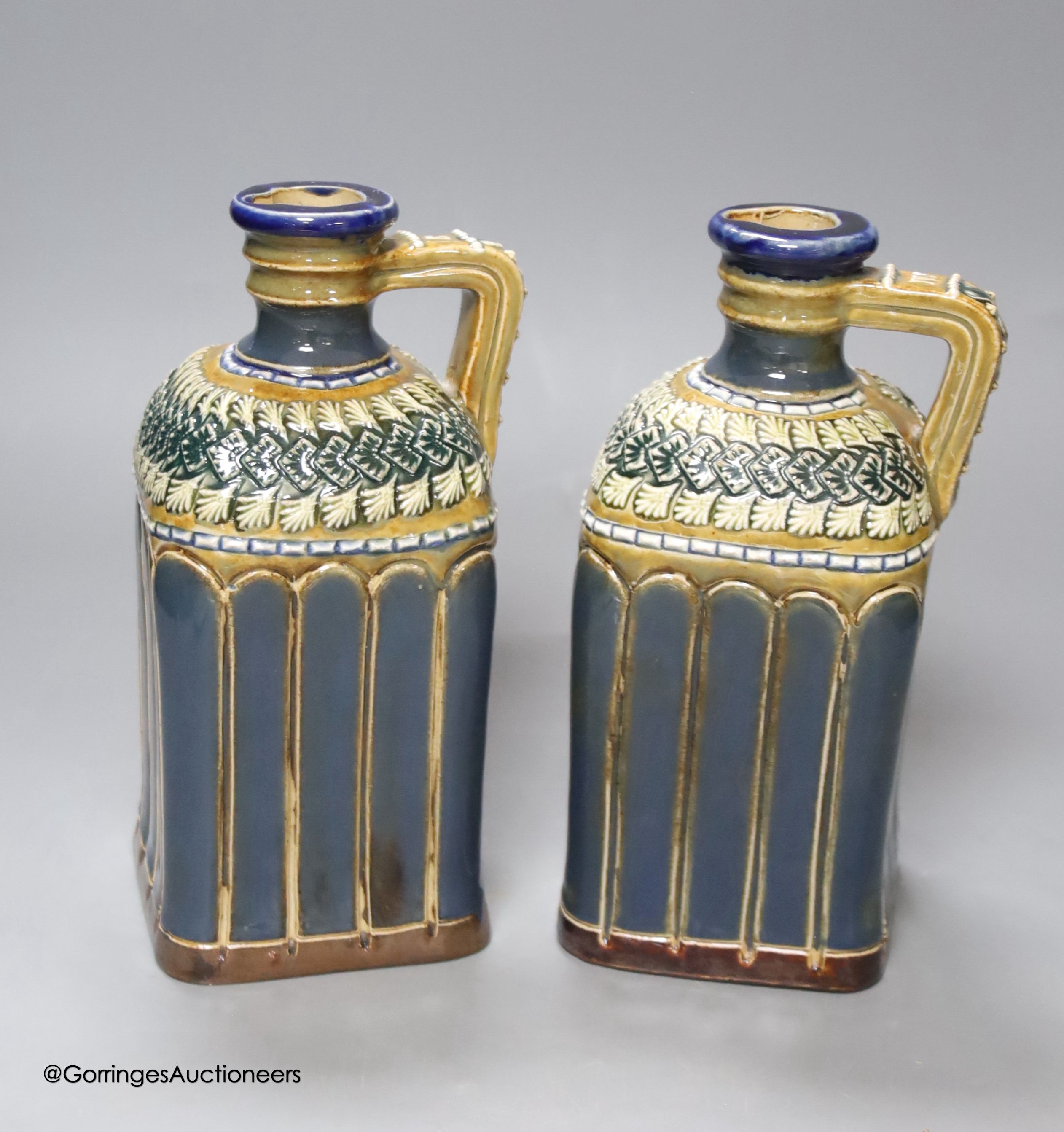 A pair of Doulton spirit decanters, 20cm high.
