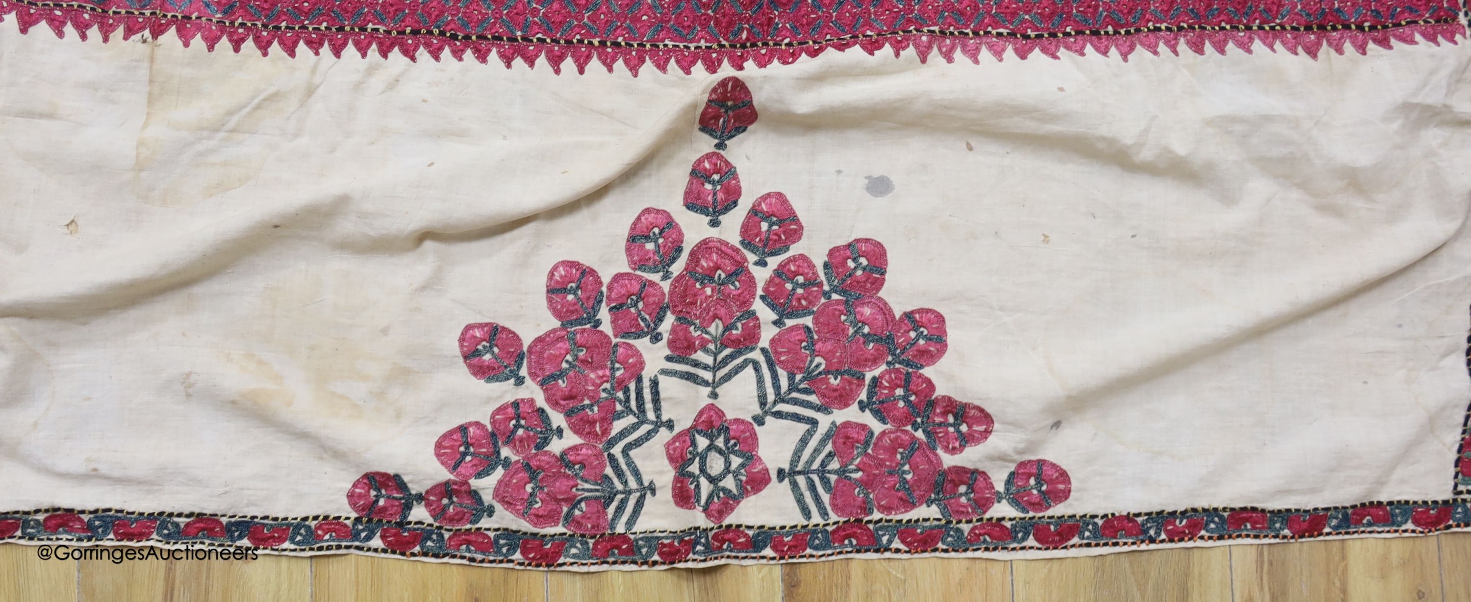 A silk embroidered Suzani, embroidered with cherry red flower heads with green stems and leaves in - Image 3 of 6