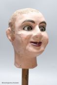 A painted ventriloquist's dummy head