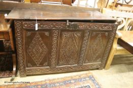 An 18th century country oak carved coffer, length 136cm, depth 60cm, height 82cm