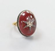 A 19th century yellow and white metal, oval cabochon garnet and rose cut diamond set ring, with