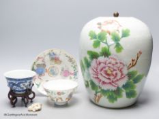 A 19th century famille rose bowl and stand, a blue and white cup, a famille rose jar and a stone