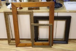 An early 19th century English parcel gilt and ebonised hardwood picture frame, aperture 56 x 47cm,