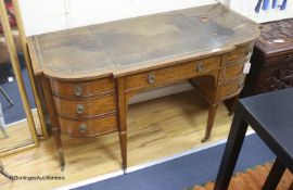 An Edwardian banded breakfront kneehole desk, length 142cm, depth 63cm, height 75cm