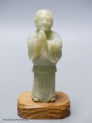 A Chinese celadon jade figure of a priest
