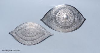 A Chinese Straits large white metal belt buckle, of curved navette form and a similar smaller