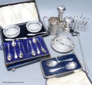 Two silver capstan pepper mills, a cased pair of silver preserve spoons, a Mappin & Webb silver and