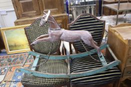 A Victorian cast metal rocking horse, on painted wood bow rocker stand, length 96cm height 62cm