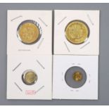 Four gold coins; 1901 ten roubles, 1900 ten roubles, 1862 one dollar and mini St Gauden coin.