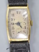 A gentleman's 1930's 9ct gold manual wind tonneau shaped wrist watch, with case back inscription,