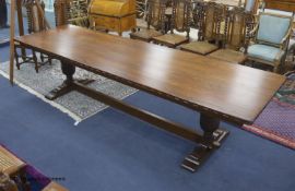 A reproduction 18th century style oak refectory table, width 310cm depth 91cm height 76cm