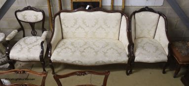 A late Victorian mahogany three piece salon suite