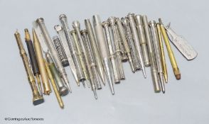 A group of silver and metal propelling pencils