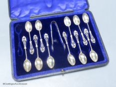 A cased set of eleven (ex 12) pierced silver teaspoons and pair of sugar tongs, John Round & Son