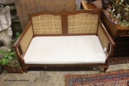 A 1920's Bergere settee, length 128cm, depth 70cm, height 76cm