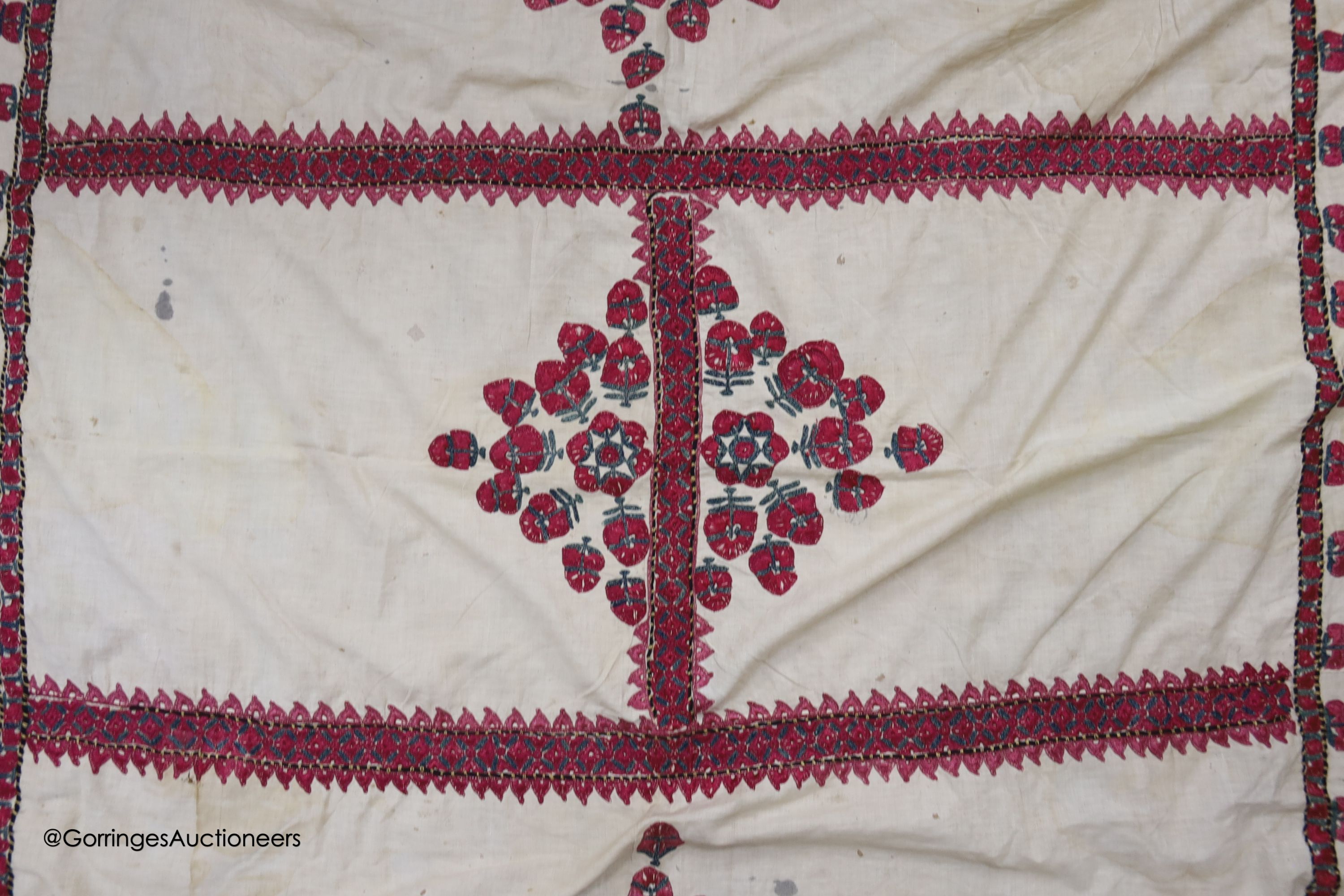 A silk embroidered Suzani, embroidered with cherry red flower heads with green stems and leaves in - Image 4 of 6