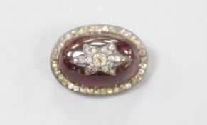A 19th century yellow and white metal, oval cabochon garnet, rose and old cut diamond set brooch(