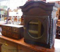 A nest of six drawers and a clock hood