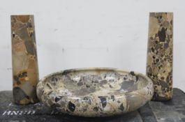 A variegated stone garniture, circular bowl, 30cm, a pair of vases, 25cm