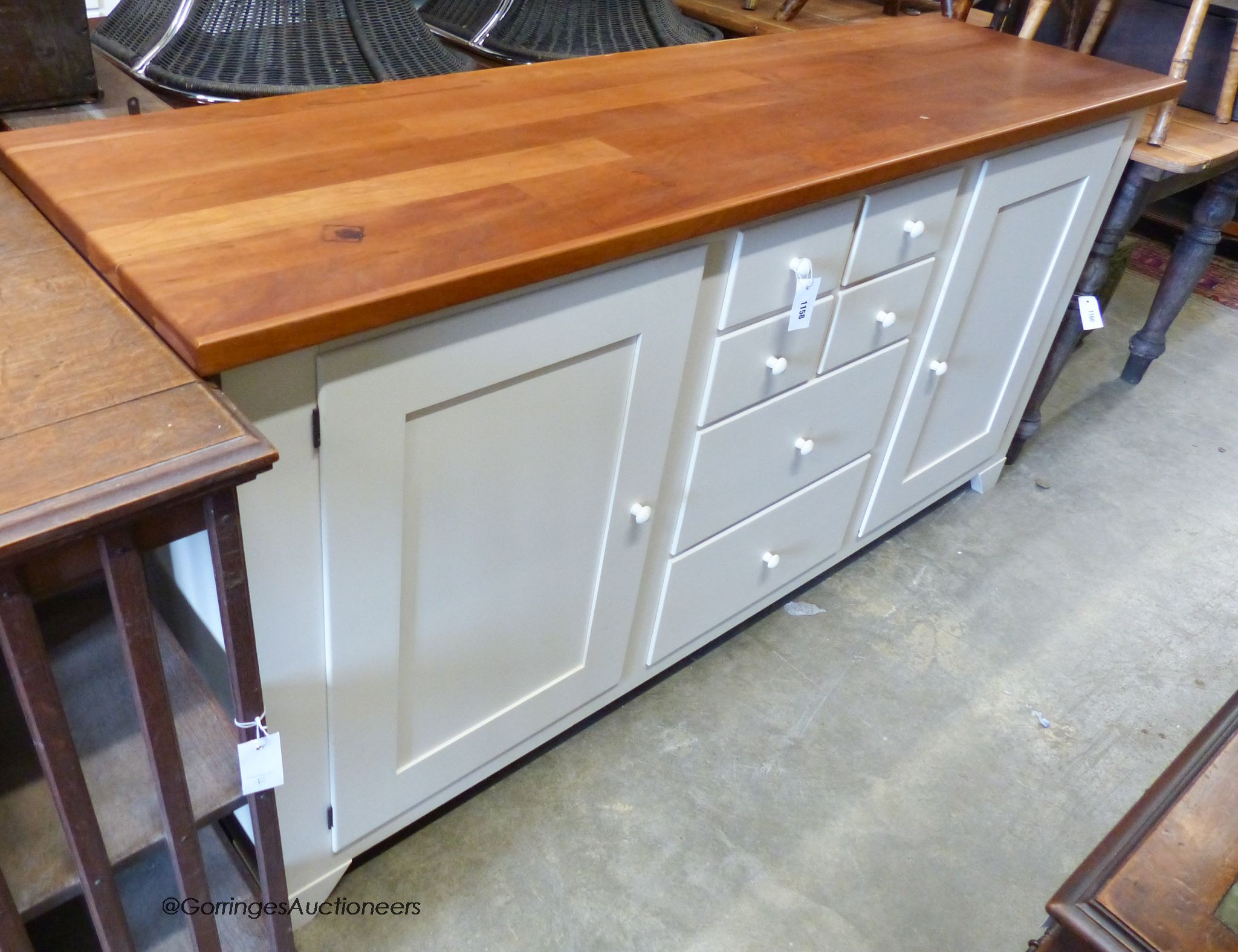 A modern white painted kitchen unit with hardwood top. W-182, D-51, H-90.
