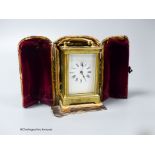 A brass cased carriage timepiece, 7.5cm, in a leather carrying case,