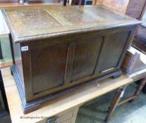 A 1920's panelled oak coffer. W-90, D-45, H-55cm.