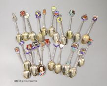 Twenty five assorted 20th century silver and enamel souvenir spoons, including Brighton,