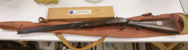 A 19th century percussion rifle, walnut stock, with ram rod, in canvas case, complete with gun