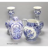 A pair of Dutch Delft blue and white vases, 29cm, a similar ovoid jar and cover and a bulbous jug