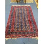 A Bokhara blue ground carpet. 240x150.