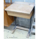 A vintage oak student's desk, width 56cm, depth 47cm, height 77cm