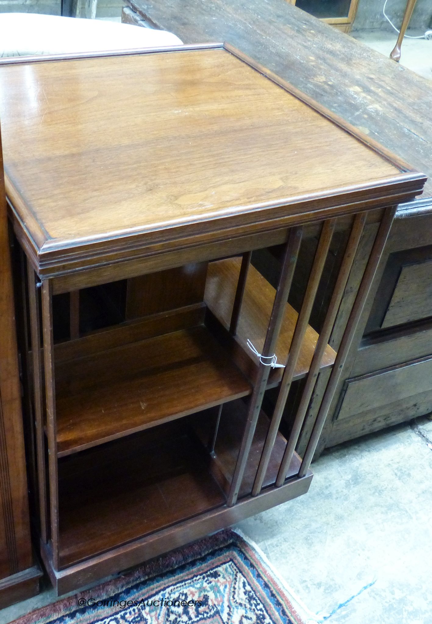 An Edwardian walnut revolving bookcase, length 53cm, height 81cm