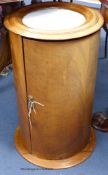 A Victorian mahogany cylindrical marble top pot cupboard. D-35, H-62cm.
