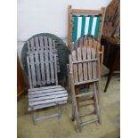Six assorted weathered teak folding garden chairs, two similar circular tables and a deck chair.