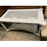 A rectangular painted caned top two tier coffee table, length 120cm, depth 66cm, height 58cm