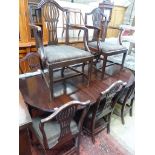 A set of eight Hepplewhite style mahogany dining chairs (two having arms)