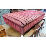 A large Victorian style footstool on six turned feet, length 156cm, depth 91cm, height 42cm