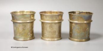 A pair of George V Brittania standard silver beakers, with engraved inscription, W. H. Haseler Ltd,