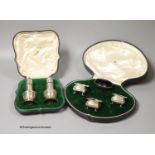 A cased pair of George V silver pepperettes, Mappin & Webb, London, 1913, 11.3cm and a cased