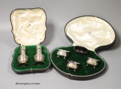 A cased pair of George V silver pepperettes, Mappin & Webb, London, 1913, 11.3cm and a cased