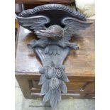 A Black Forest carved oak eagle wall bracket, width 47cm, height 56cm