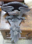 A Black Forest carved oak eagle wall bracket, width 47cm, height 56cm