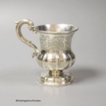 A mid 19th century Indian Colonial white metal vase shaped christening mug, by George Gordon & Co,