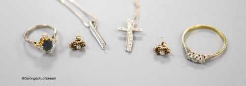 An 18ct, sapphire? and diamond set dress ring, size I/J, a yellow metal and three stone diamond